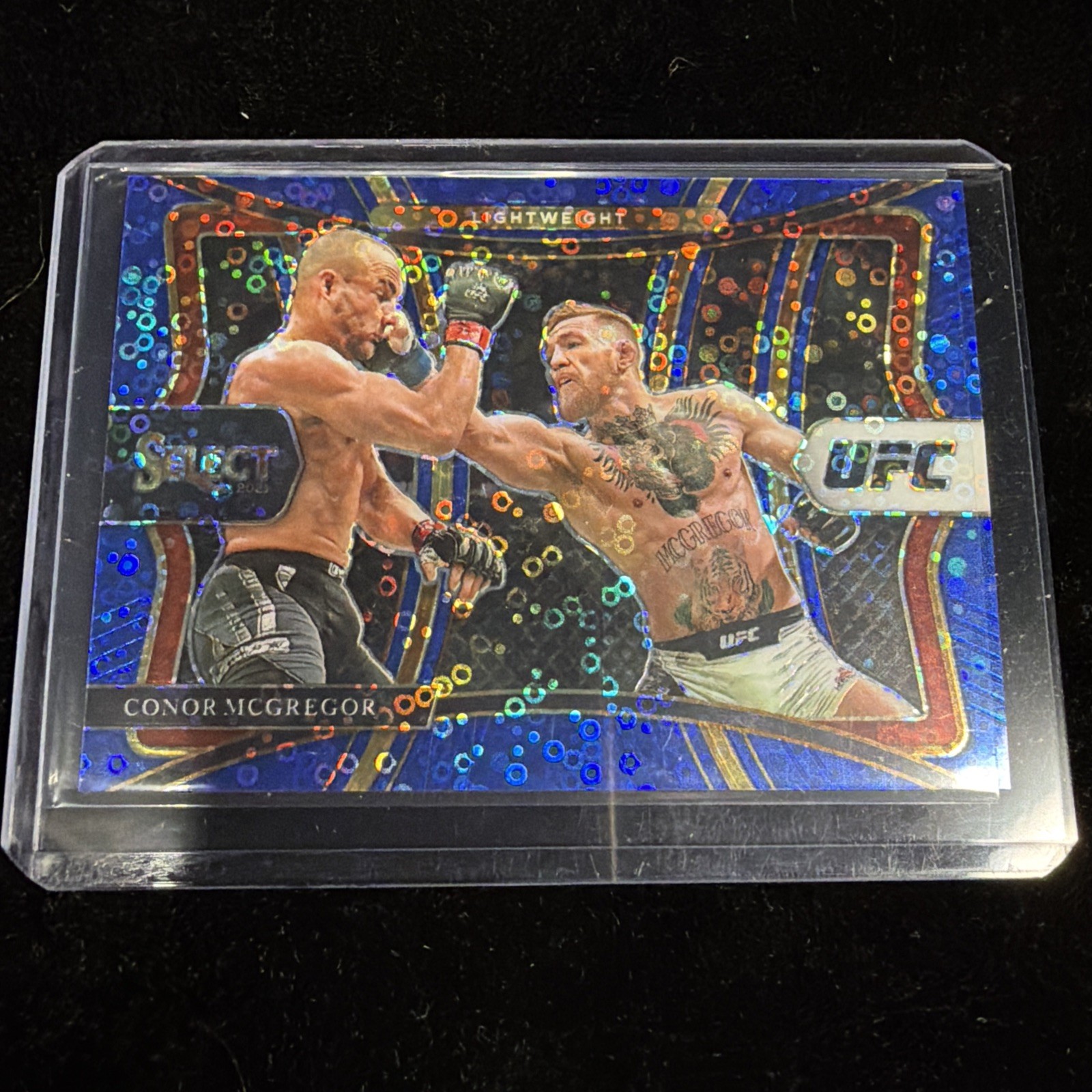 Conor McGregor 2021 Panini Select UFC Premier Blue Disco Prizm Card 17/99 #199
