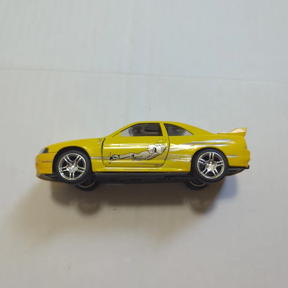 Coche fundido a presión Jada Fast & Furious Leon's amarillo Nissan Skyline GT-R (BCNR33) 1:32 Foto 4 de 4