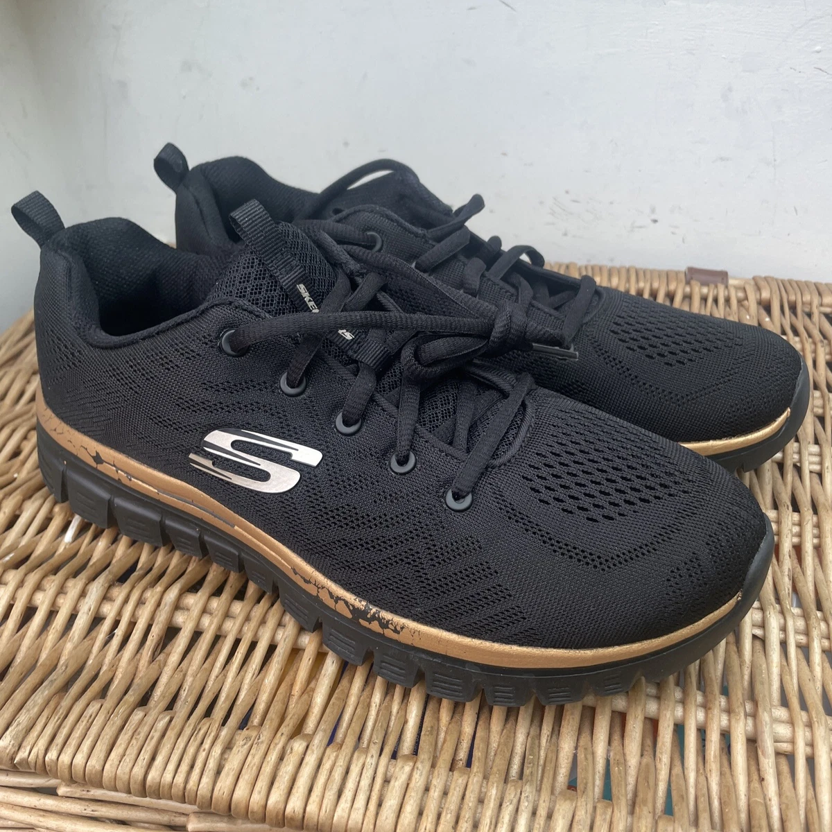 Skechers hotsell black gold