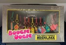 Vintage 1980s Boogie Oogie Plastic Bell Charm Necklace in Original Sealed Box