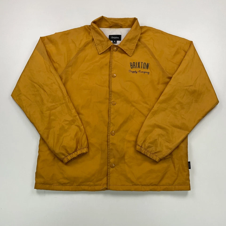 Chaqueta cortavientos Brixton CLYDE Coach para hombre mediana dorada amarilla forrada frontal a presión Foto 2 de 4