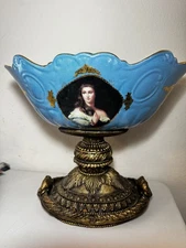 Decorative vintage-style compote bowl with portrait and ornate base