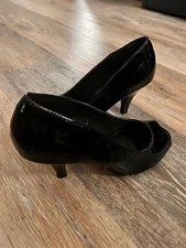 Black Pleasers pumps.  Kitten heel with open toe, patent leather.  Size 6