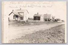 Postcard 1910 RPPC Dirt Road Residential Street in Deer Creek, MN.
