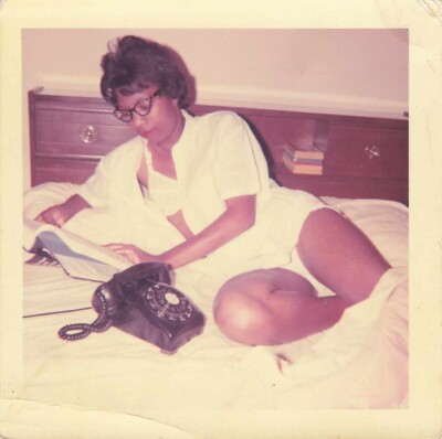 1960s snapshot photo Sexy African American Lady on bed w/ phone Sultry for GI?!