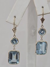 14k Yellow Gold Earrings With Genuine, Natural Blue Topaz Leverback.