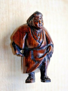A Chinese Or Japanese Scholar Netsuke Figure With Character Mark On Reverse.