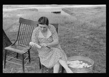 Demonstrating process of canning corn at community canning kitchen - Old Photo