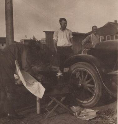 1920s Men Working Fixing Car Flat Tire Outdoor Garage Scene Early Automobile
