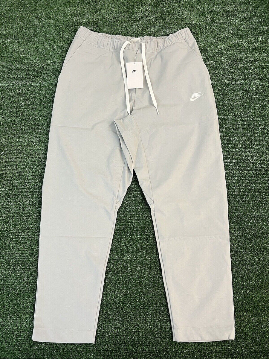Nike Club Woven Tapered Leg Pants Standard Fit Grey Mens Nike Club Woven Tapered Leg Pants Standard Fit Grey Mens