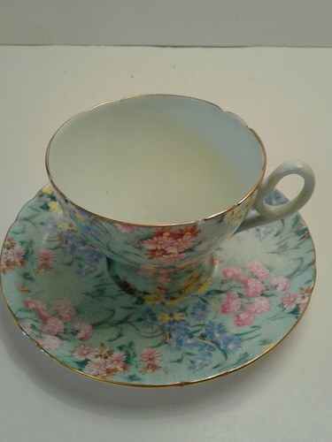 shelley melody chintz cup and saucer green background no damage