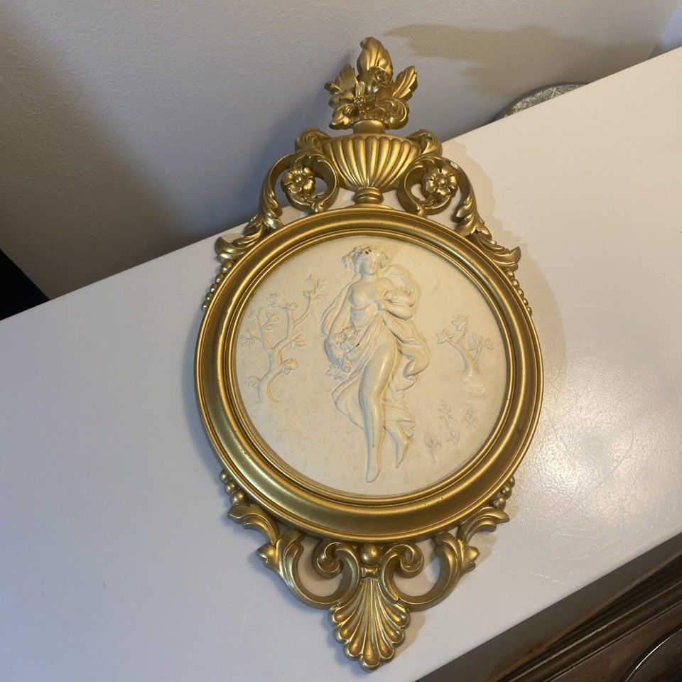 A Syroco 'Joyful Dancing Maiden' plastic resin wall plaque — a cult-favorite MCM brand that serious vintage hunters actively seek out.