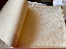 Damask-style Cream -on -cream damask-style tablecloth matching 16 placemats.
