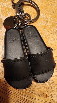 Christian Louboutin Loubipool Sole key ring With miniature black spiked slides.