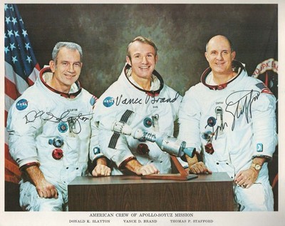 ASTP US CREW SIGNED NASA LITHOGRAPH OF CREW POSING IN WHITE SPACE SUITS