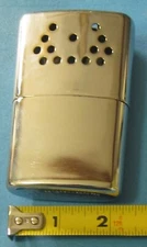 Vintage JON-E Hand Warmer/heater, metal, with red pouch 