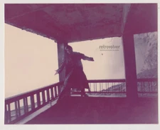 Daring Steps on the Edge Lone Young Woman Balancing Between Light and Abyss