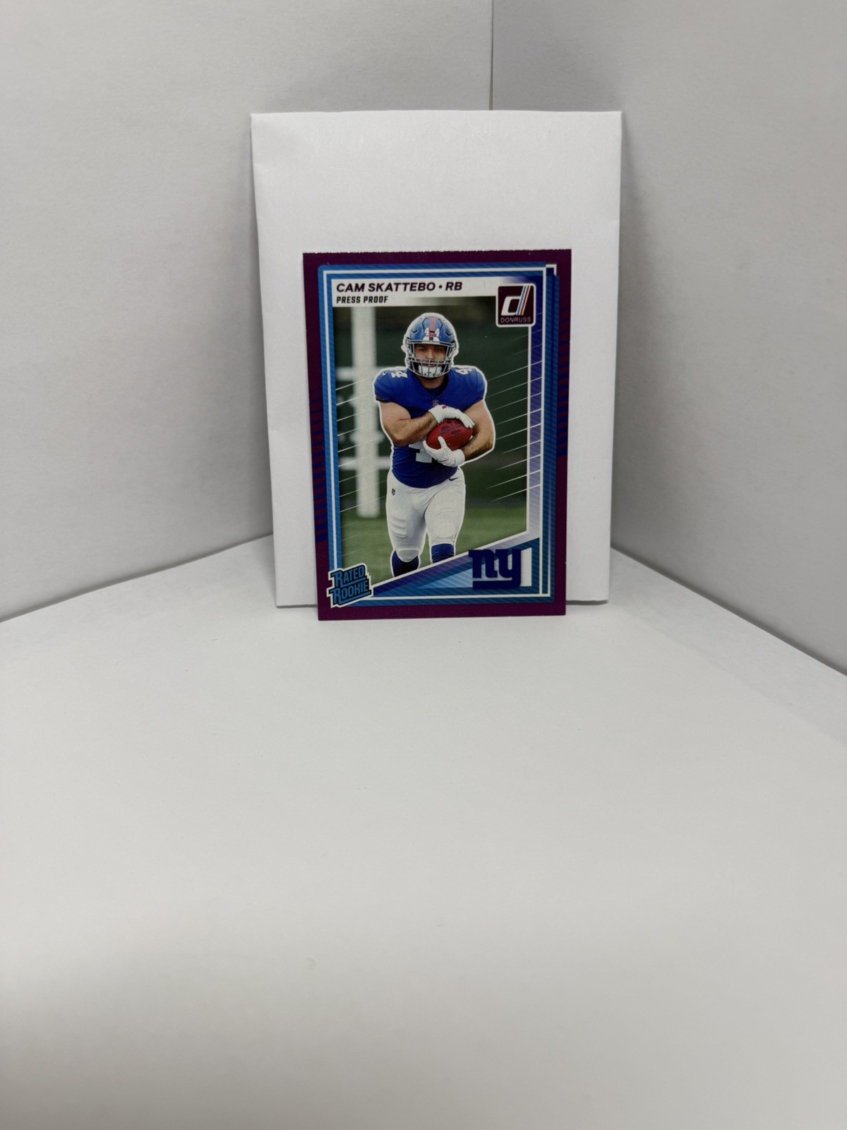 2025 Panini Donruss - Rated Rookie Cam Skattebo #302 Purple Press Proof (RC)