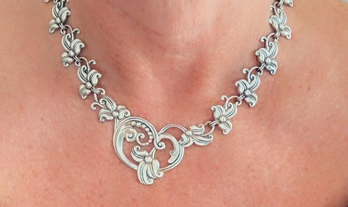 Taxco sterling silver necklace, bracelet, and earrings