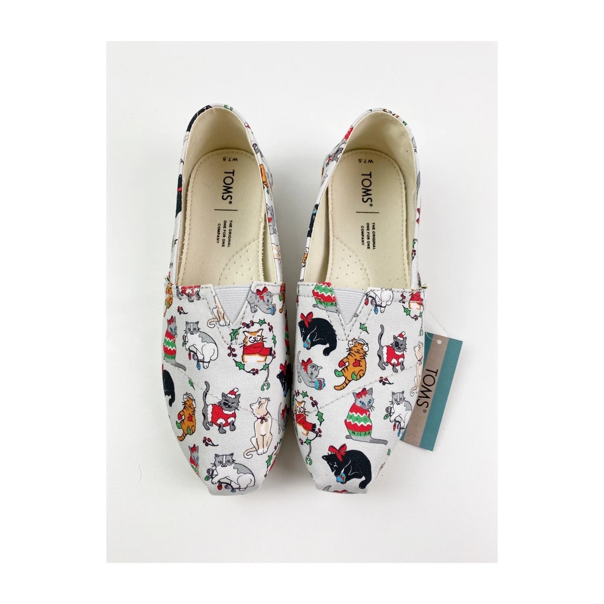 Toms shoes with shop cats on them