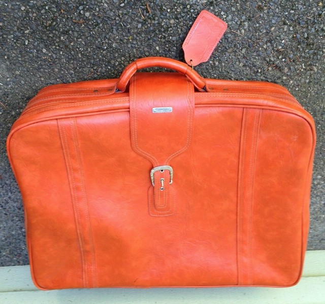 orange samsonite suitcase