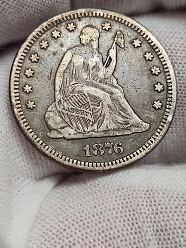 1876 Philadelphia Mint Silver Seated Liberty Quarter in VF with Original Toning