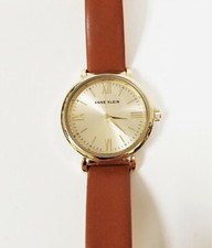 NEW ANNE KLEIN GOLD TONE,BROWN LEATHER BACKING,ROMAN NUMERALS WATCH AK/2954