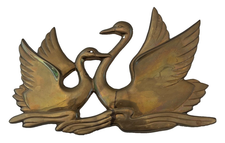 A 19-inch solid brass swan wall sculpture in vintage gold — the kind of dramatic, sculptural statement piece people stop and stare at.