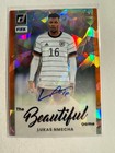 K158,393 - 2022-23 Donruss Beautiful Game Auto Orange Ice #26 Lukas Nmecha