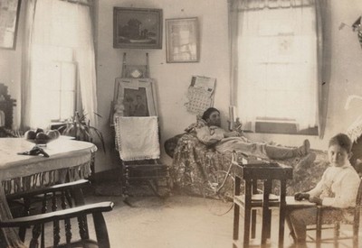 Candid Interior Scene Dad Reading Boy Riding Old Bike Cool Image 1910s Room