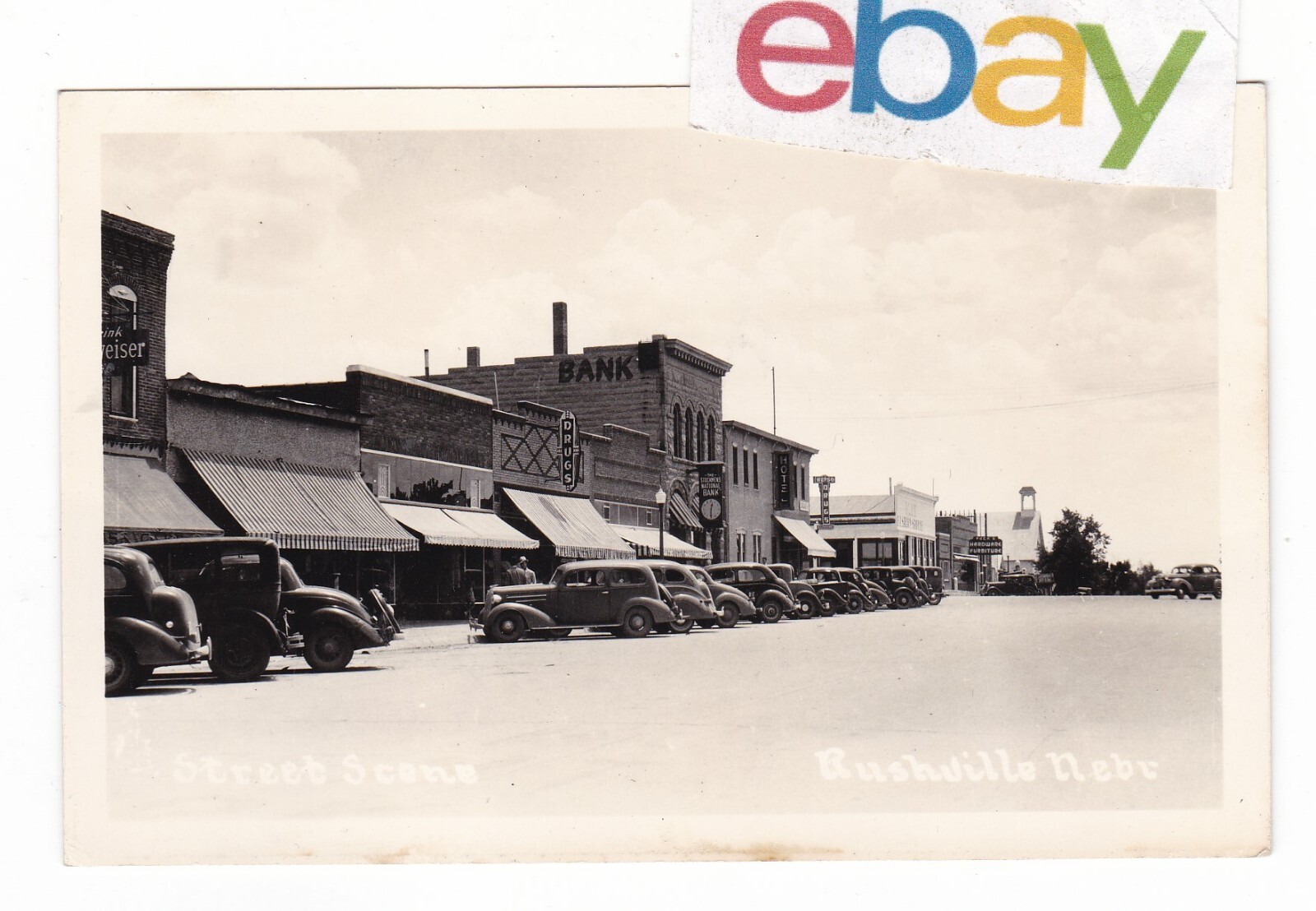 c1940 RPPC RUSHVILLE NEBRASKA STOCKMENS BANK PECKS CARS VINTAGE