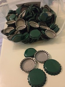 New Green steel bottle caps, approximately 475 count.