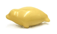 Vintage figurine of a baby harp seal, made of Balanite Pellucida and signed by J