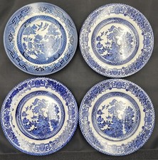 Four mixed blue and white willow pattern side plates 16.75 / 17 cm