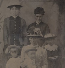 PORTRAIT OF WOMEN W/ THREE SMALL CHILDREN IN FLORAL HATS