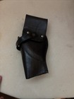 This black leather holster appears to be a Smith & Wesson B21 model — photo 2