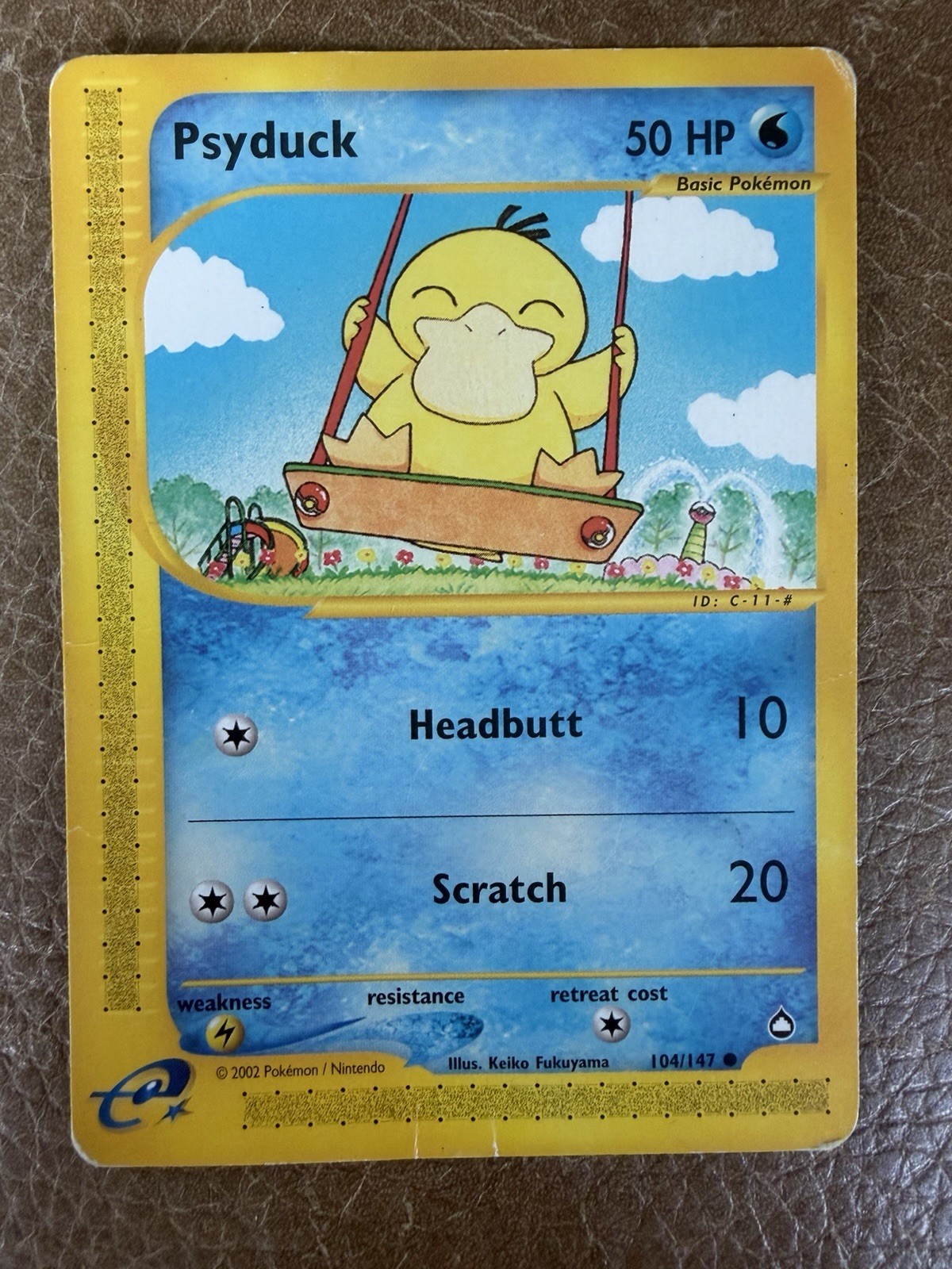 2002 Pokemon Psyduck 104/147 Aquapolis Regular