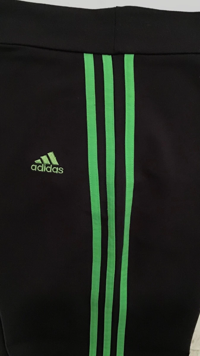 Adidas pants hotsell with green stripes