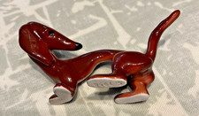 Vintage small stylised dachshund figurine in flame red 1958 maker unknown