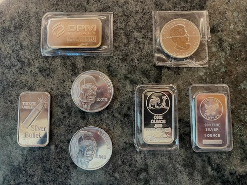 7 ounces of Fine Silver. 100 % unique of coins and bars, 7 total, 1 oz each Nice
