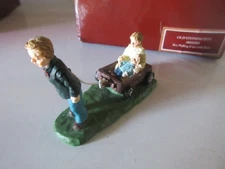 LANG and WISE Folk Art Villages Old Stonington Boy Pulling Cart with Baby