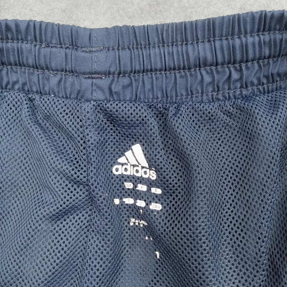 Pantalones deportivos Adidas para hombre medianos azul marino amarillo a rayas entrenamiento de fútbol Foto 2 de 4