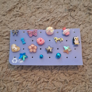 Clips of star, flower, butterfly, horse, penguin, donut, cupcake, and bows. (15)