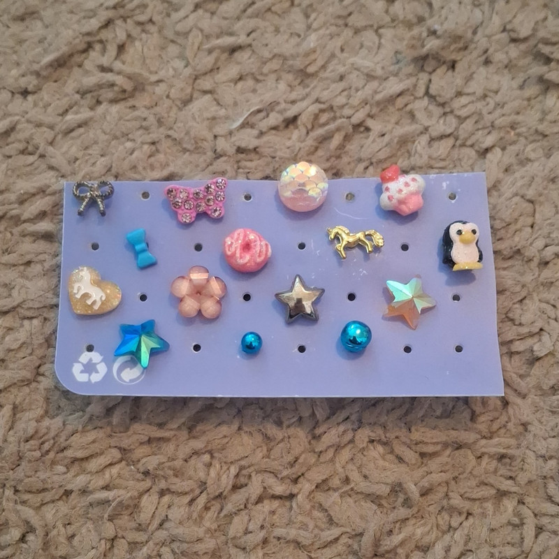 Clips of star, flower, butterfly, horse, penguin, donut, cupcake, and bows. (15)