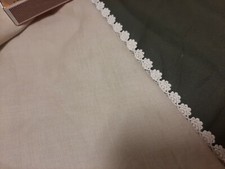 10 plus yards . Vintage 1/2  cream lace edging.