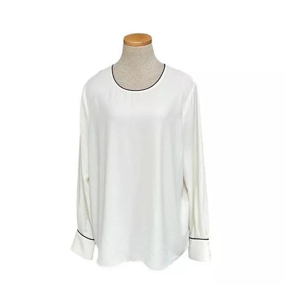 cream blouse with black trim