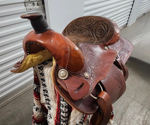 Saddle, Western style, intricately hand tooled