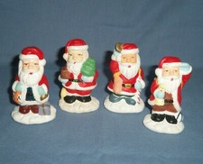 Lot 4 Ceramic Santa Claus Christmas Figurines with Bags Baskets on Their Backs