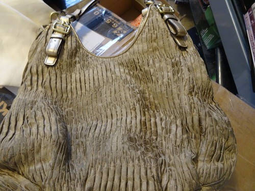 can coach purses be dry cleaned