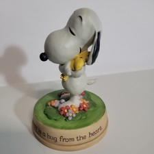 Statuina Snoopy Woodstock Arachidi "La felicità è un abbraccio dal cuore" Punzone